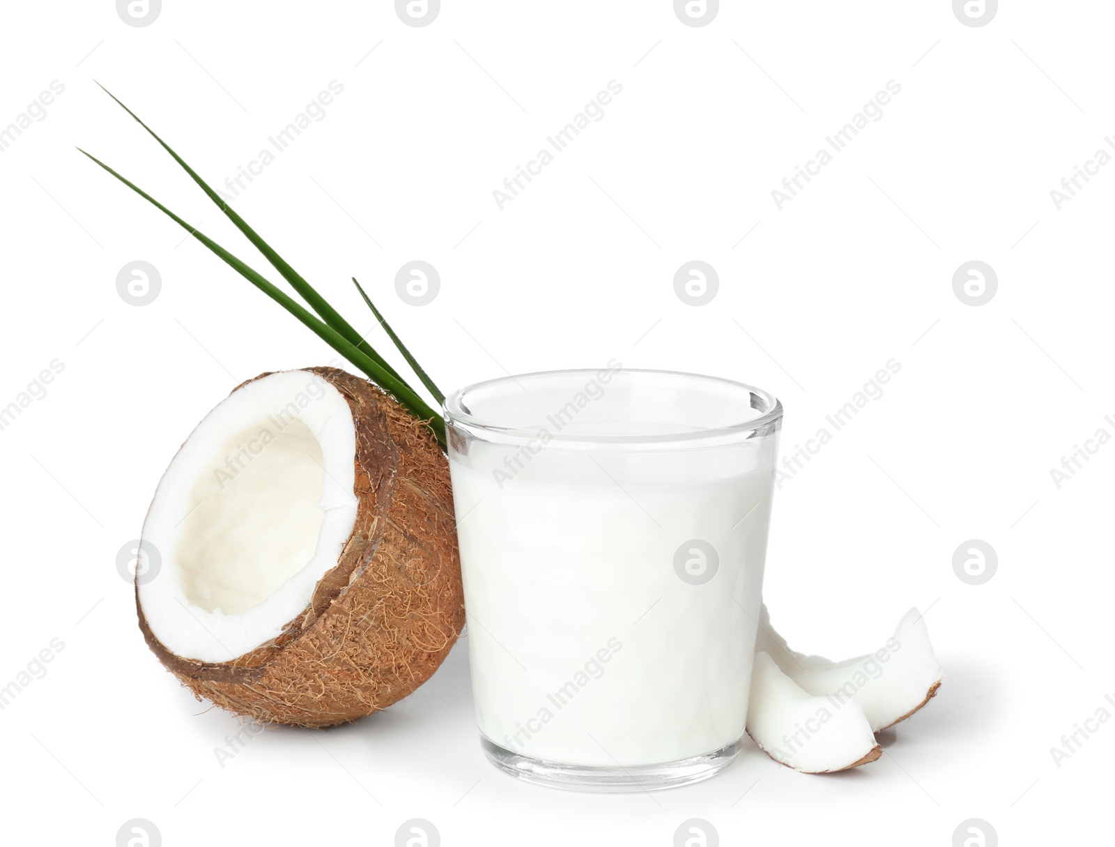 Photo of Glass of coconut milk and fresh nut on white background