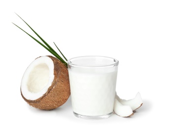 Photo of Glass of coconut milk and fresh nut on white background