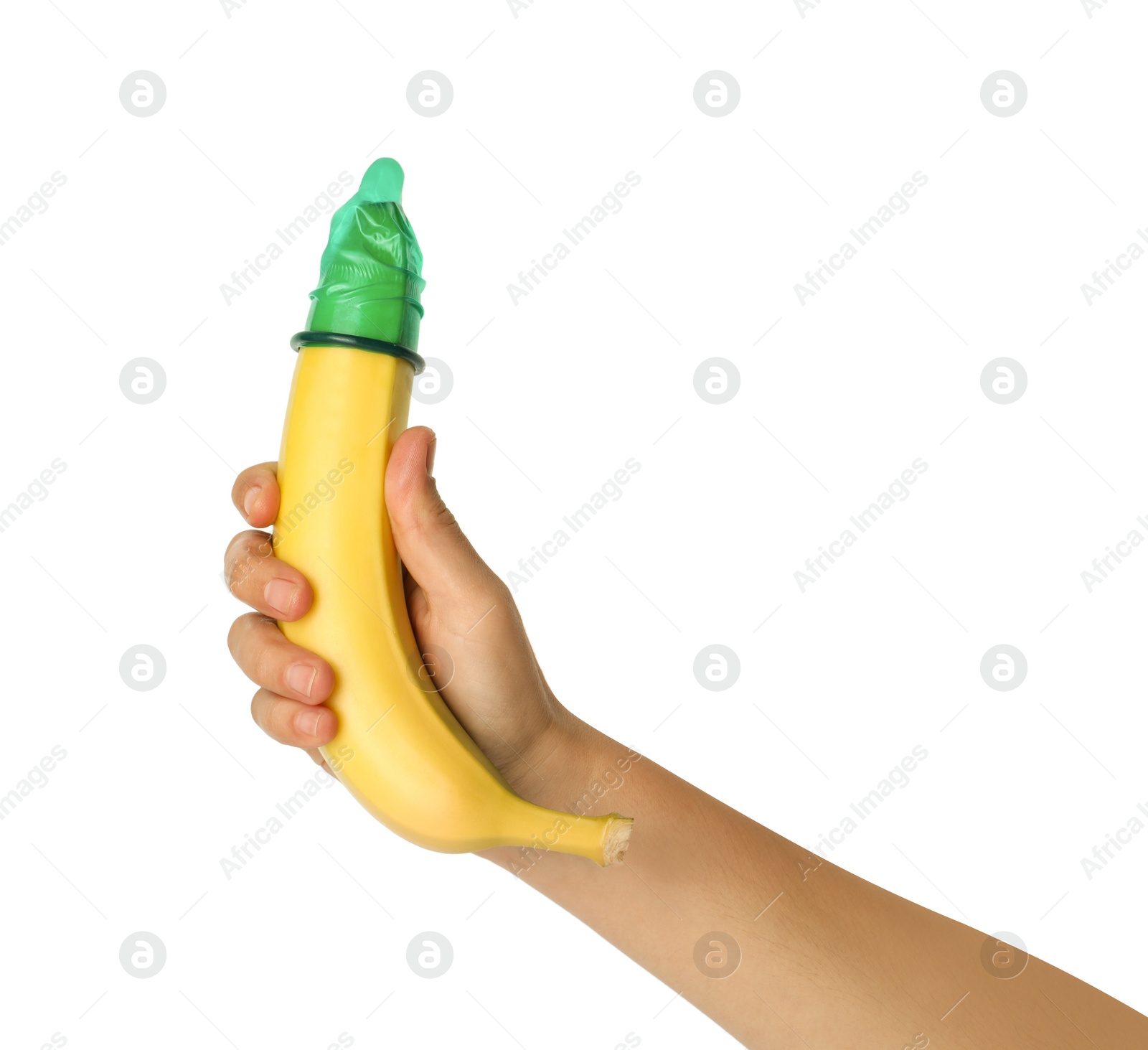 Photo of Woman holding banana in condom on white background, closeup. Safe sex concept