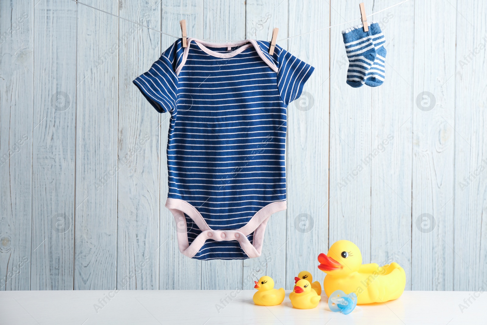 Photo of Composition with baby accessories on wooden background