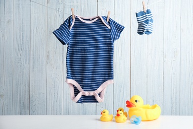 Photo of Composition with baby accessories on wooden background