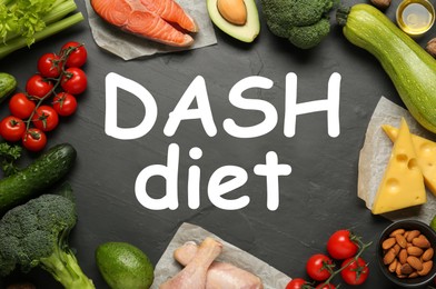 Dietary approaches to stop hypertension. Many different healthy food around words Dash diet on black textured table, flat lay