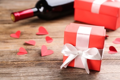 Beautiful gift box on wooden table, closeup. Valentine's Day celebration