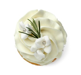 Photo of Tasty Easter cupcake with vanilla cream isolated on white, top view