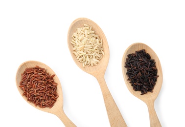 Spoons with different types of rice on white background, top view