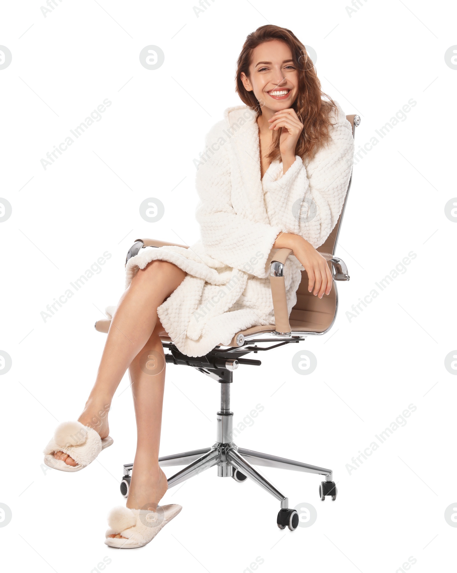 Photo of Beautiful young woman wearing bathrobe sitting in chair on white background