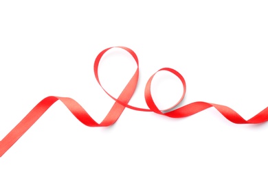 Photo of Simple red ribbon on white background, top view. Festive decoration