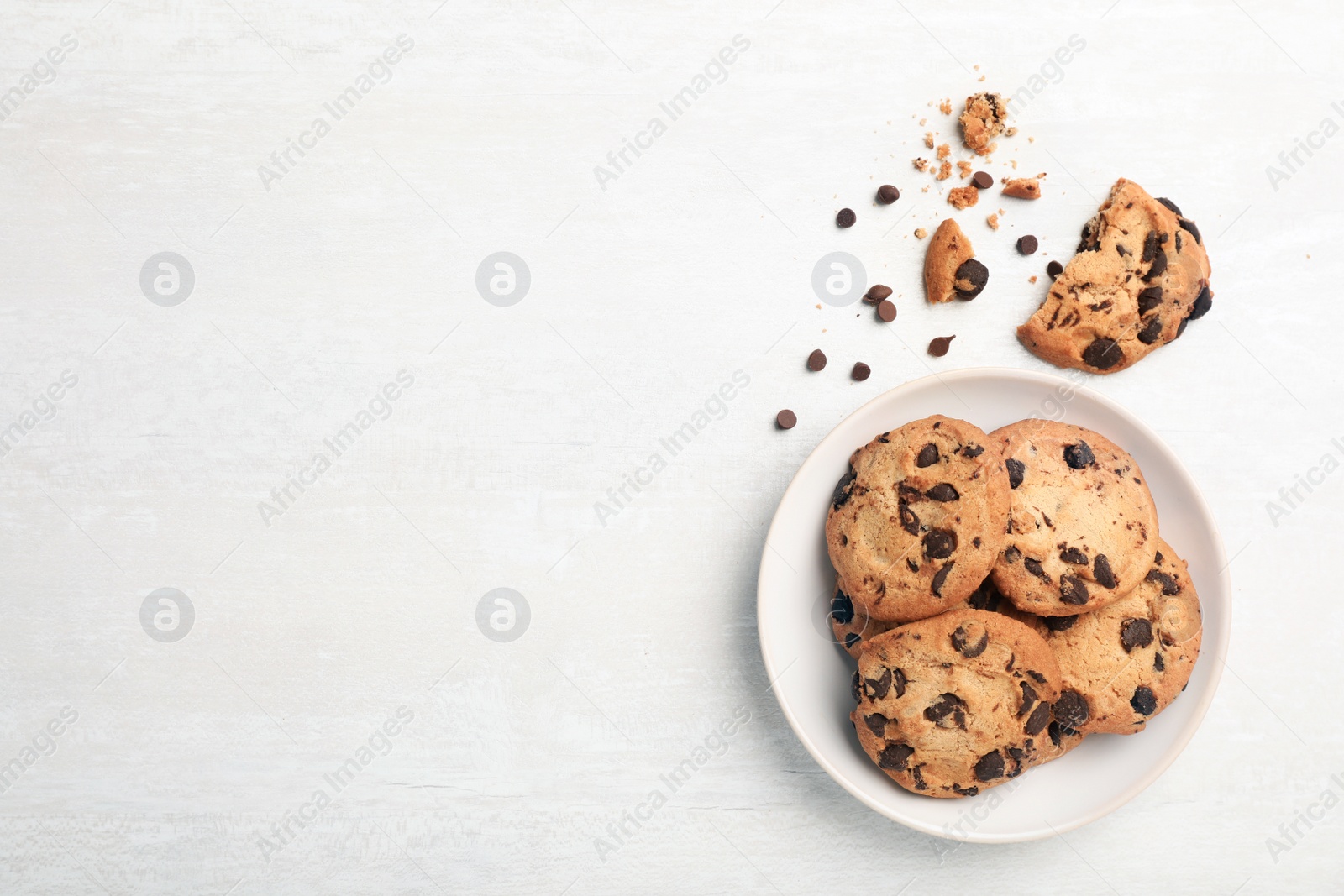 Photo of Flat lay composition with chocolate cookies and space for text on light background