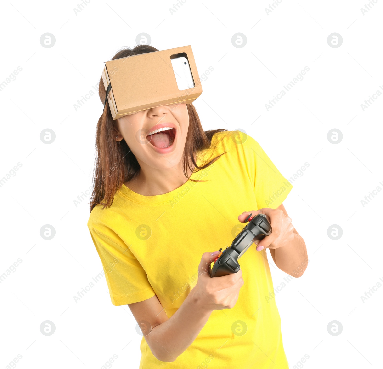 Photo of Young woman using cardboard virtual reality headset, isolated on white