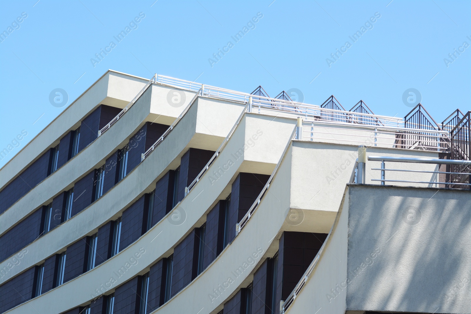 Photo of Exterior of beautiful residential building against blue sky