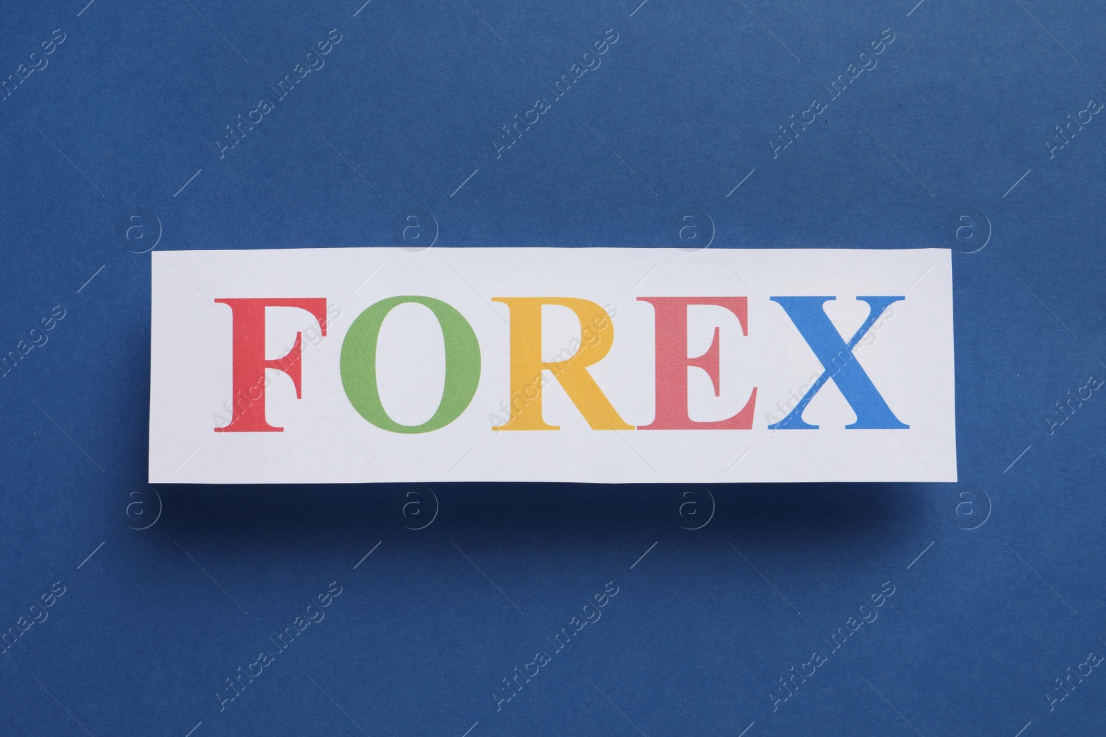 Photo of Sheet of paper with word Forex on dark blue background, top view