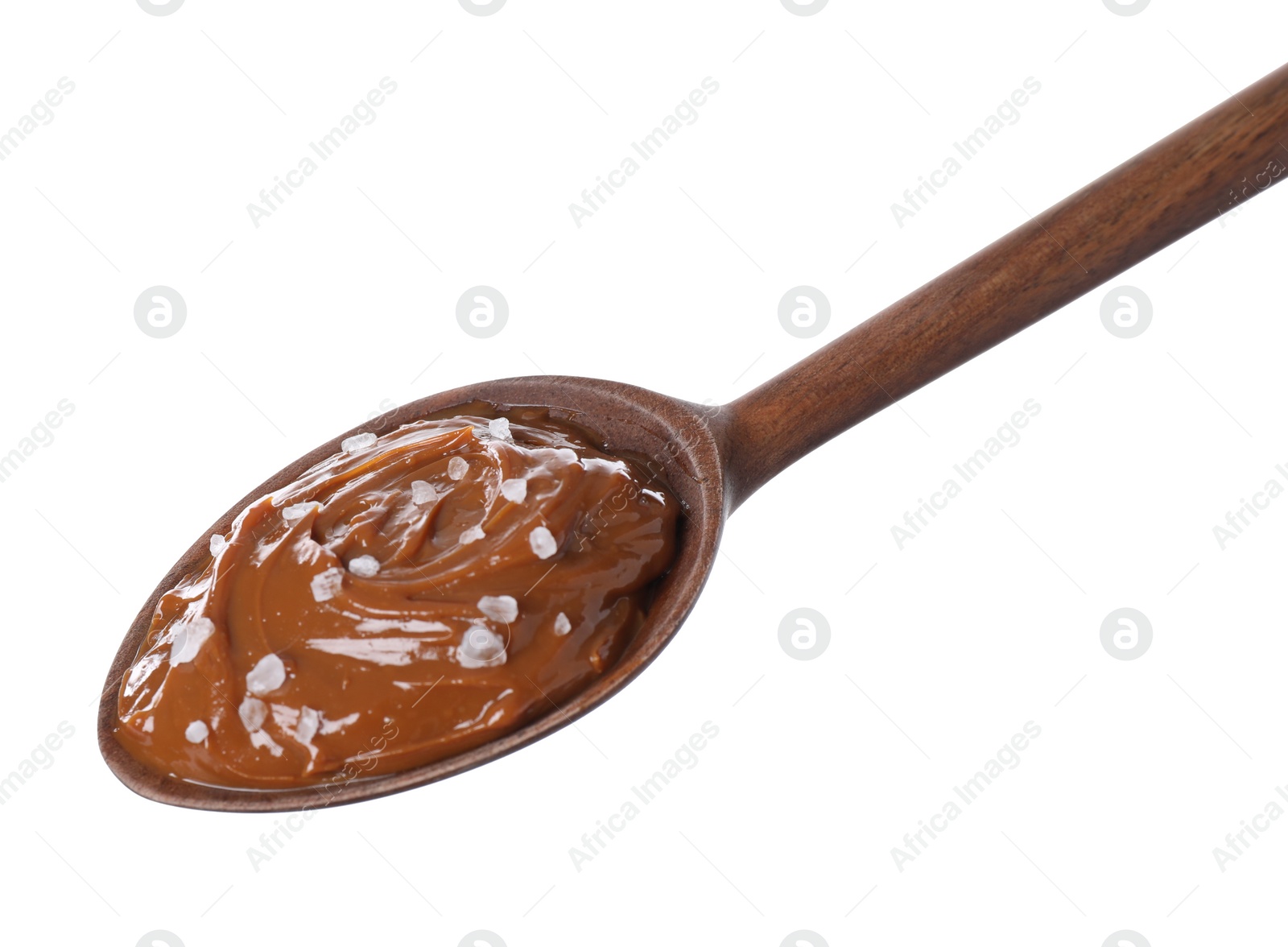 Photo of Salted caramel in spoon isolated on white