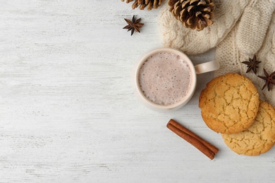 Photo of Composition with delicious hot cocoa drink and cookies on white wooden background, flat lay