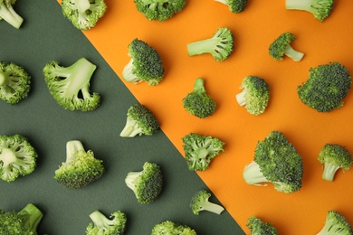 Photo of Flat lay composition with fresh green broccoli on color background