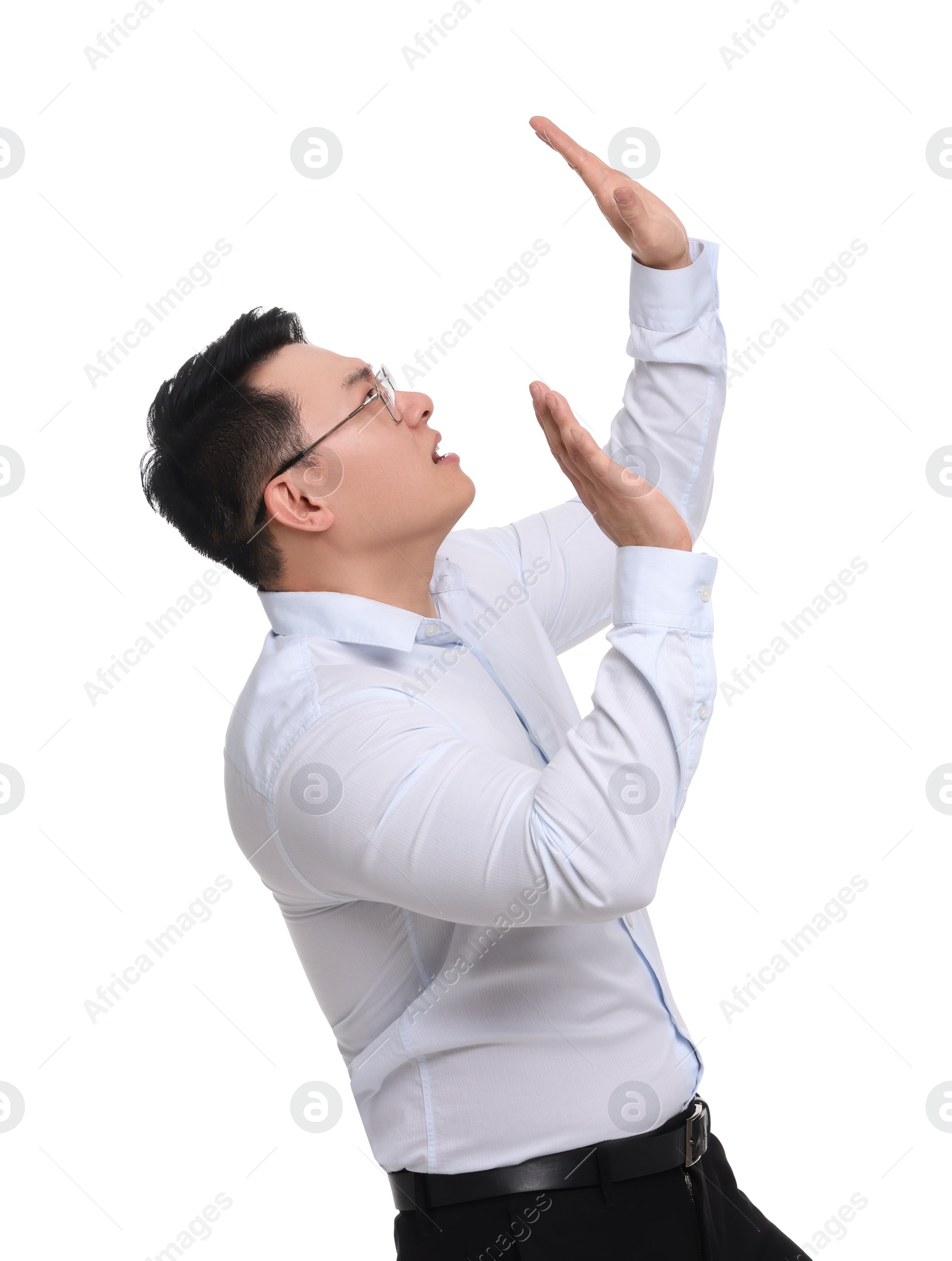 Photo of Businessman in formal clothes posing on white background