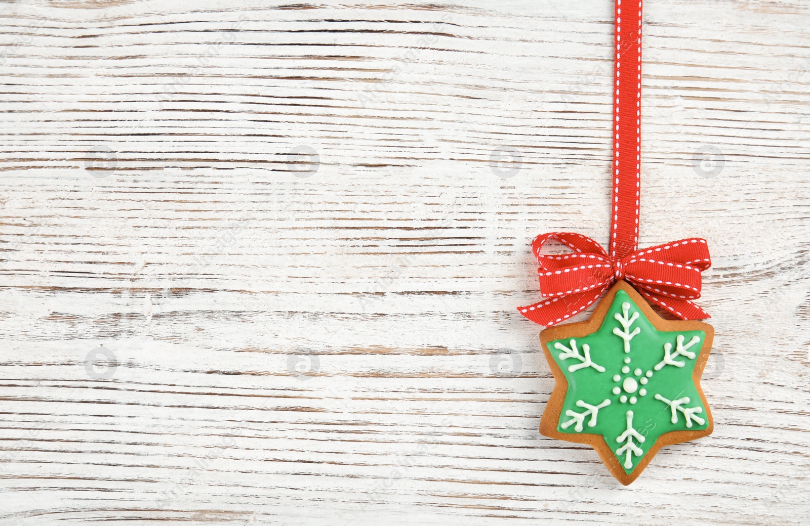 Photo of Tasty homemade Christmas cookie on wooden background, top view