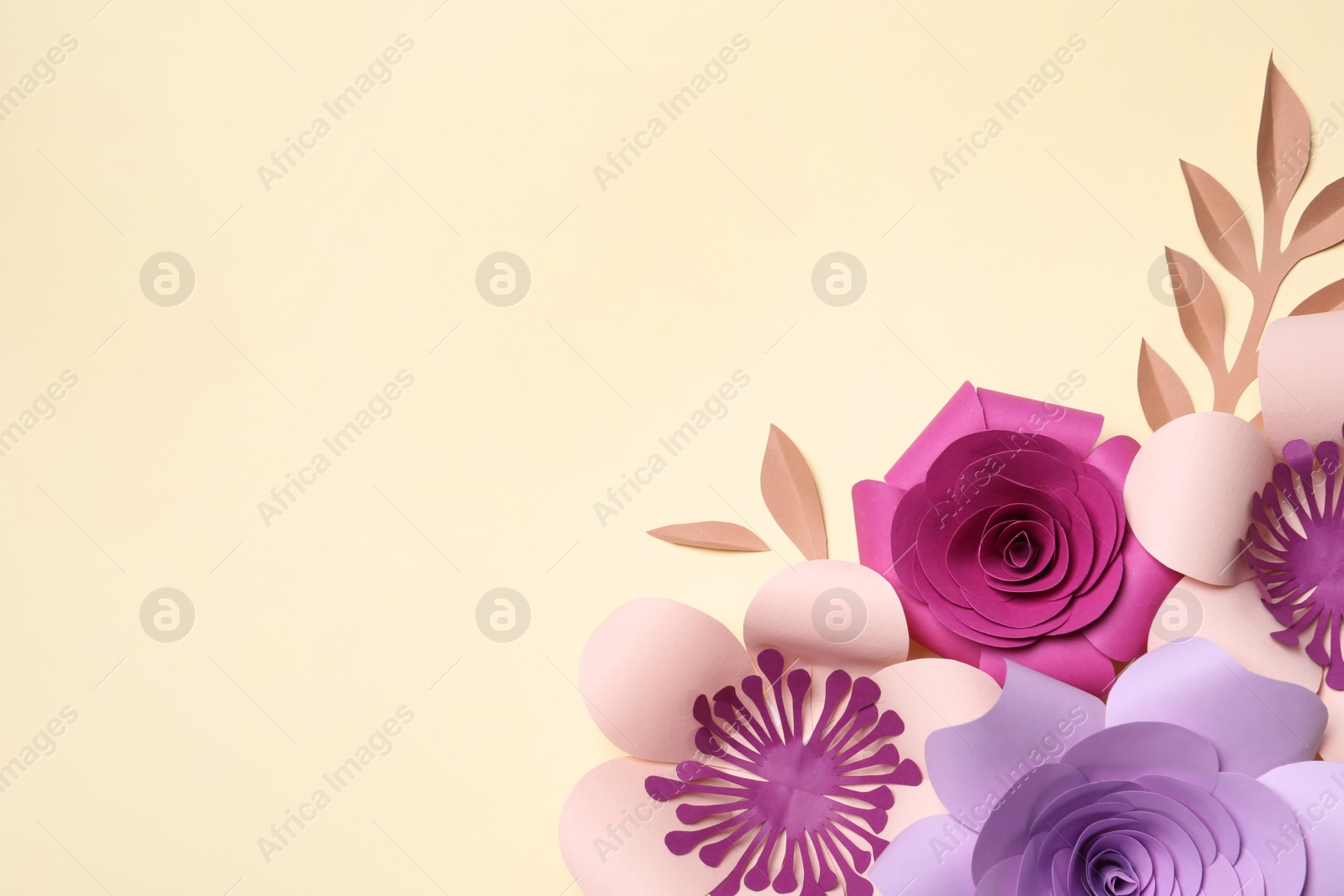 Photo of Different beautiful flowers and branches made of paper on beige background, flat lay. Space for text