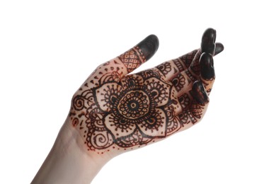 Woman with henna tattoo on palm against white background, closeup. Traditional mehndi ornament