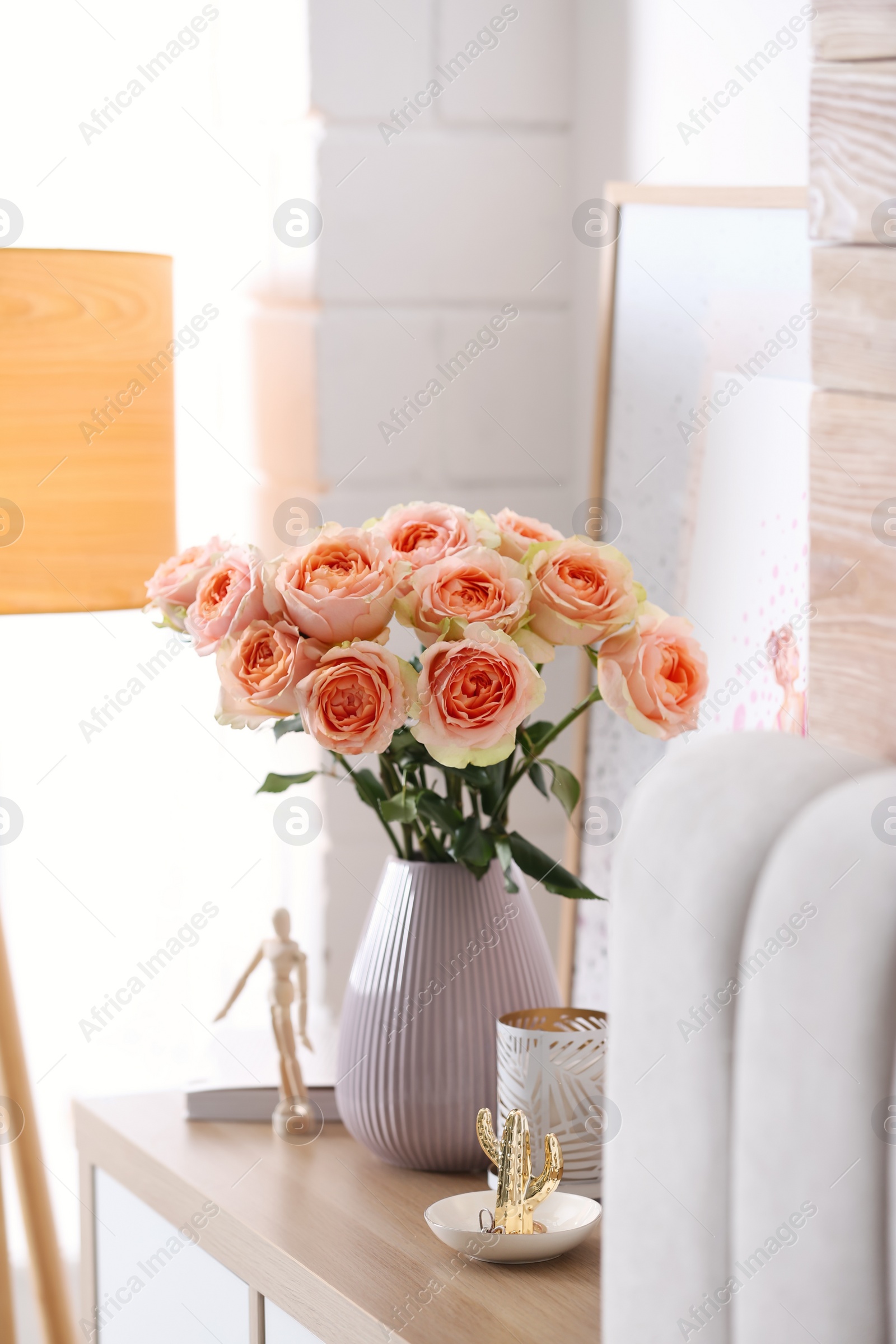 Photo of Vase with beautiful flowers in modern room interior