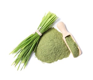 Photo of Pile of wheat grass powder, scoop and fresh sprouts isolated on white, top view