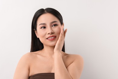 Portrait of beautiful woman on white background