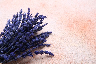 Bouquet of beautiful preserved lavender flowers on color textured table, closeup. Space for text