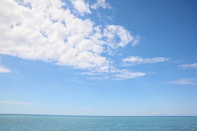 Photo of Picturesque view of sea under beautiful blue sky with fluffy clouds