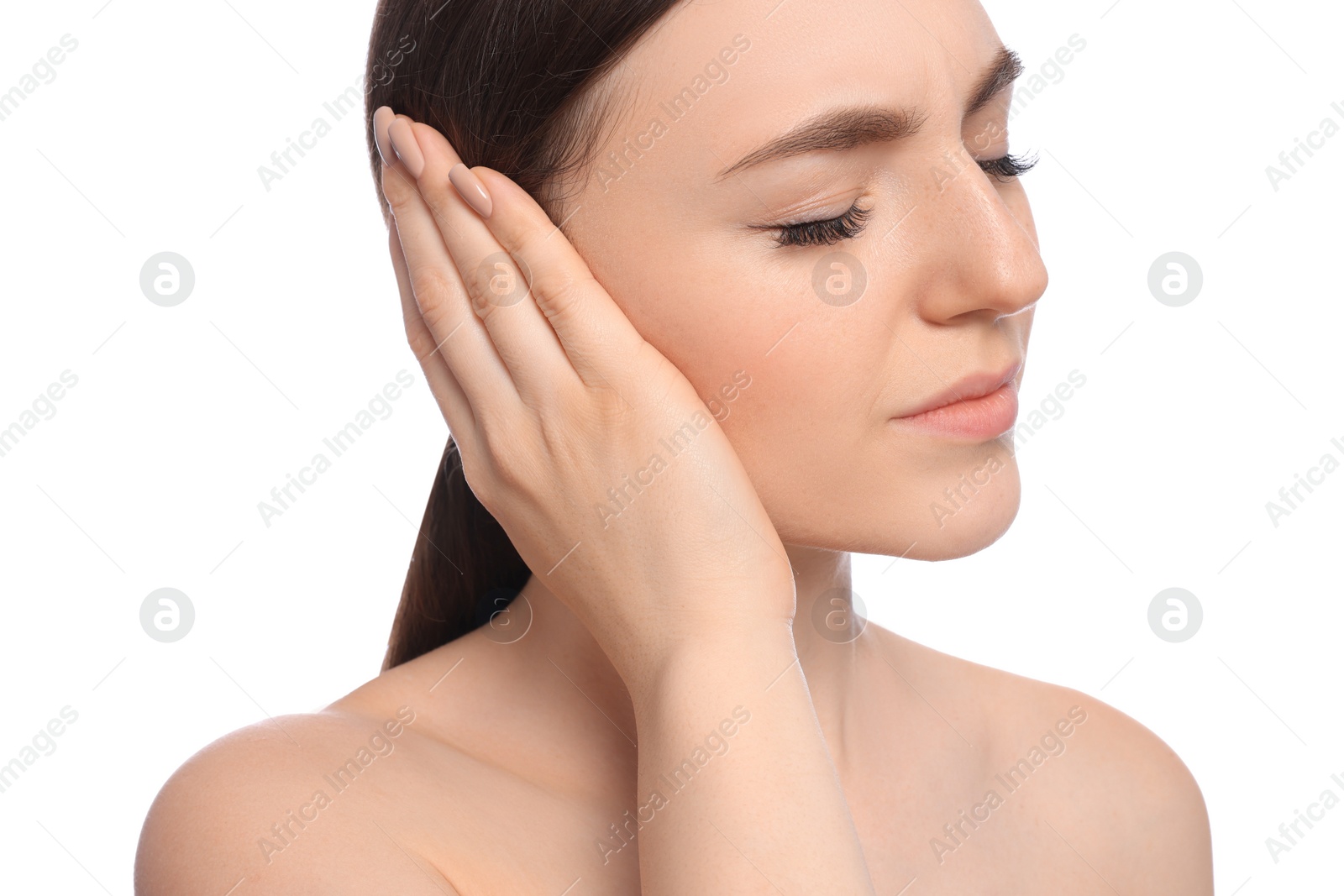 Photo of Young woman suffering from ear pain on white background, closeup