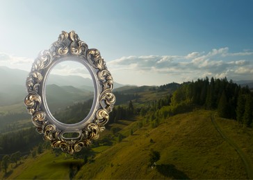 Image of Vintage frame and beautiful mountains under blue sky with clouds in morning