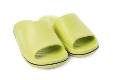 Pair of green rubber slippers isolated on white