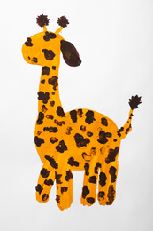 Photo of Child's painting of giraffe on white paper