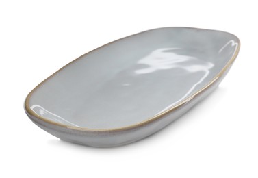 Photo of One new ceramic dish on white background