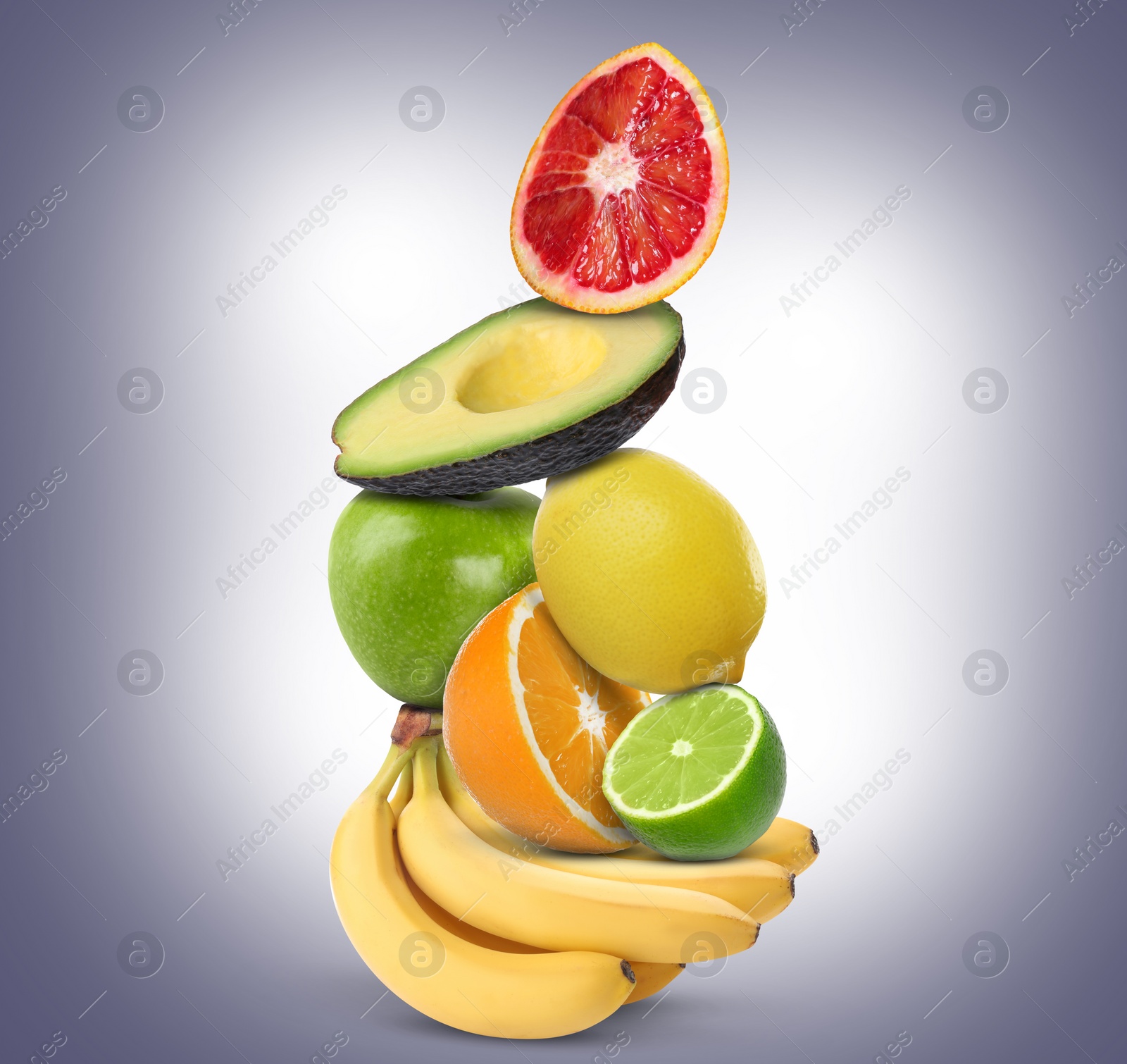 Image of Stack of different fresh fruits on pale greyish blue gradient background