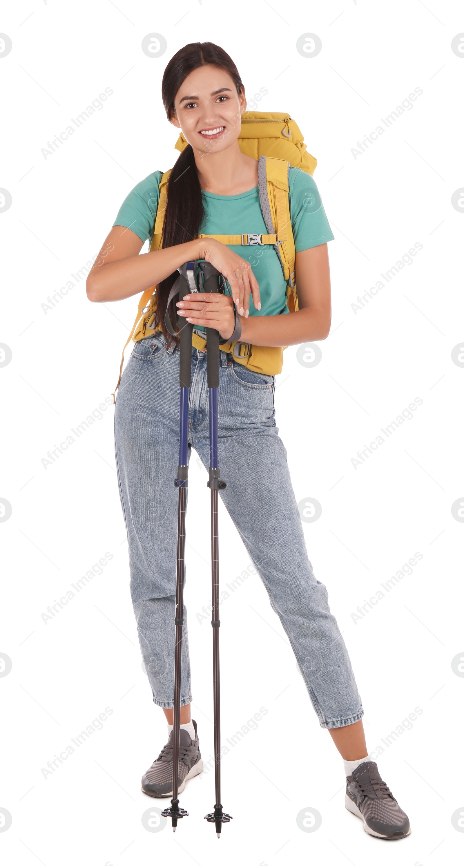 Photo of Female hiker with backpack and trekking poles on white background