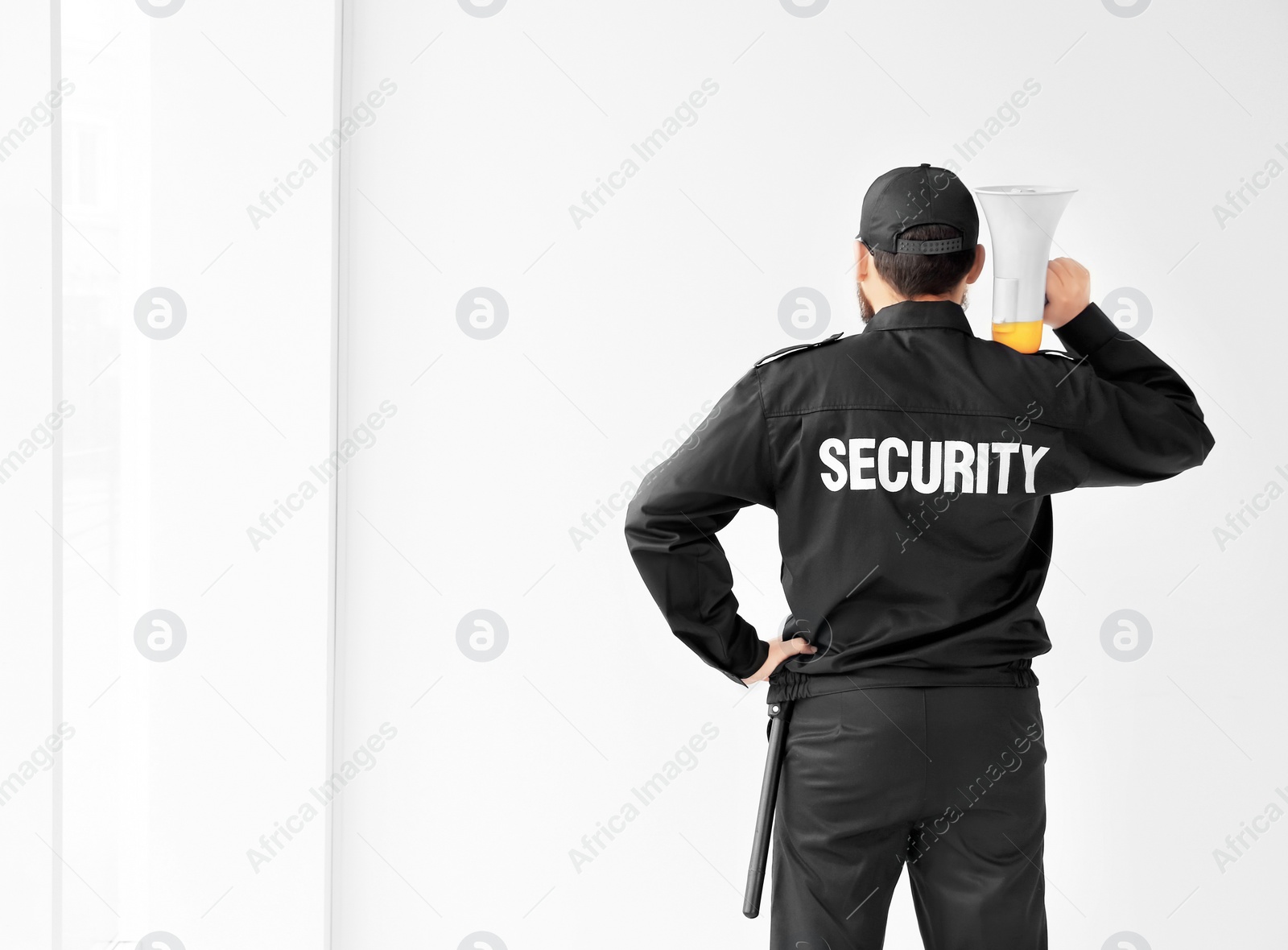 Photo of Security guard with megaphone indoors