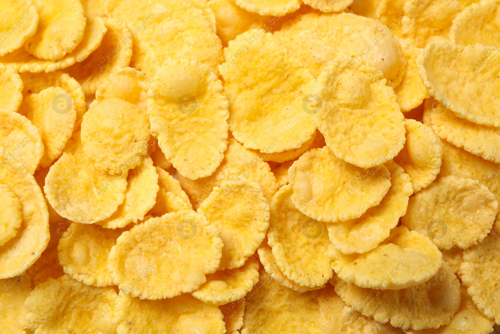 Photo of Tasty crispy corn flakes as background, top view