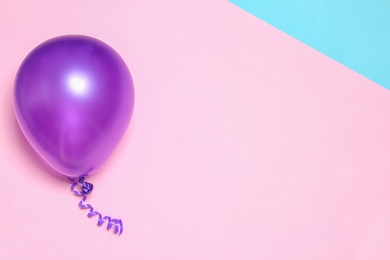 Photo of Bright balloon on colorful background, top view with space for text. Party time