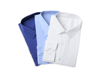 Photo of Stylish shirts isolated on white, top view. Dry-cleaning service