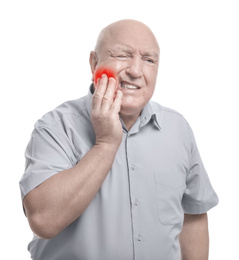 Senior man suffering from toothache on white background