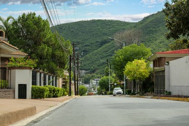 Photo of Beautiful view of city street with road near mountain