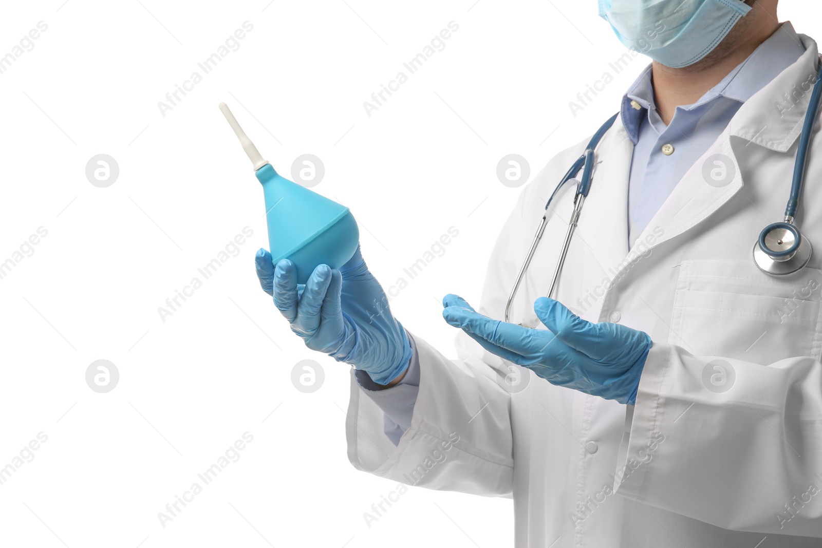Photo of Doctor holding light blue enema on white background, closeup