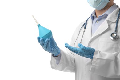 Photo of Doctor holding light blue enema on white background, closeup