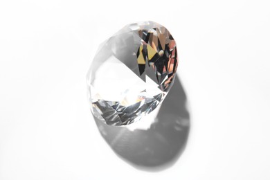 Photo of One beautiful shiny diamond on white background, above view