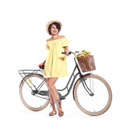 Portrait of beautiful young woman with bicycle on white background