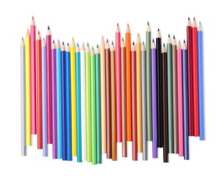 Many colorful wooden pencils on white background, top view