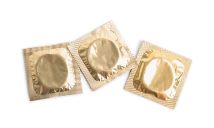 Photo of Condom packages on white background, top view. Safe sex