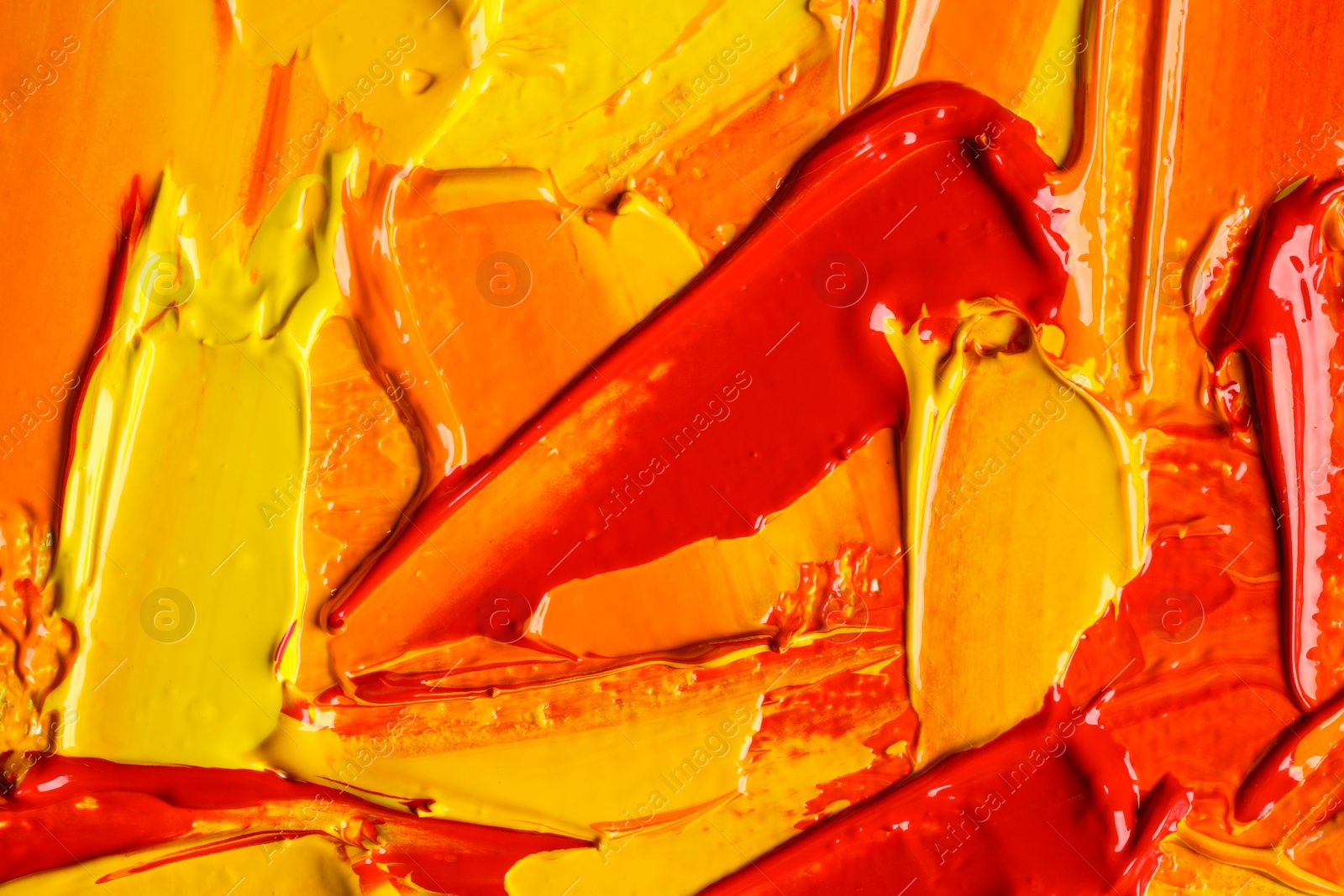 Photo of Beautiful strokes of colorful oil paints as background, closeup