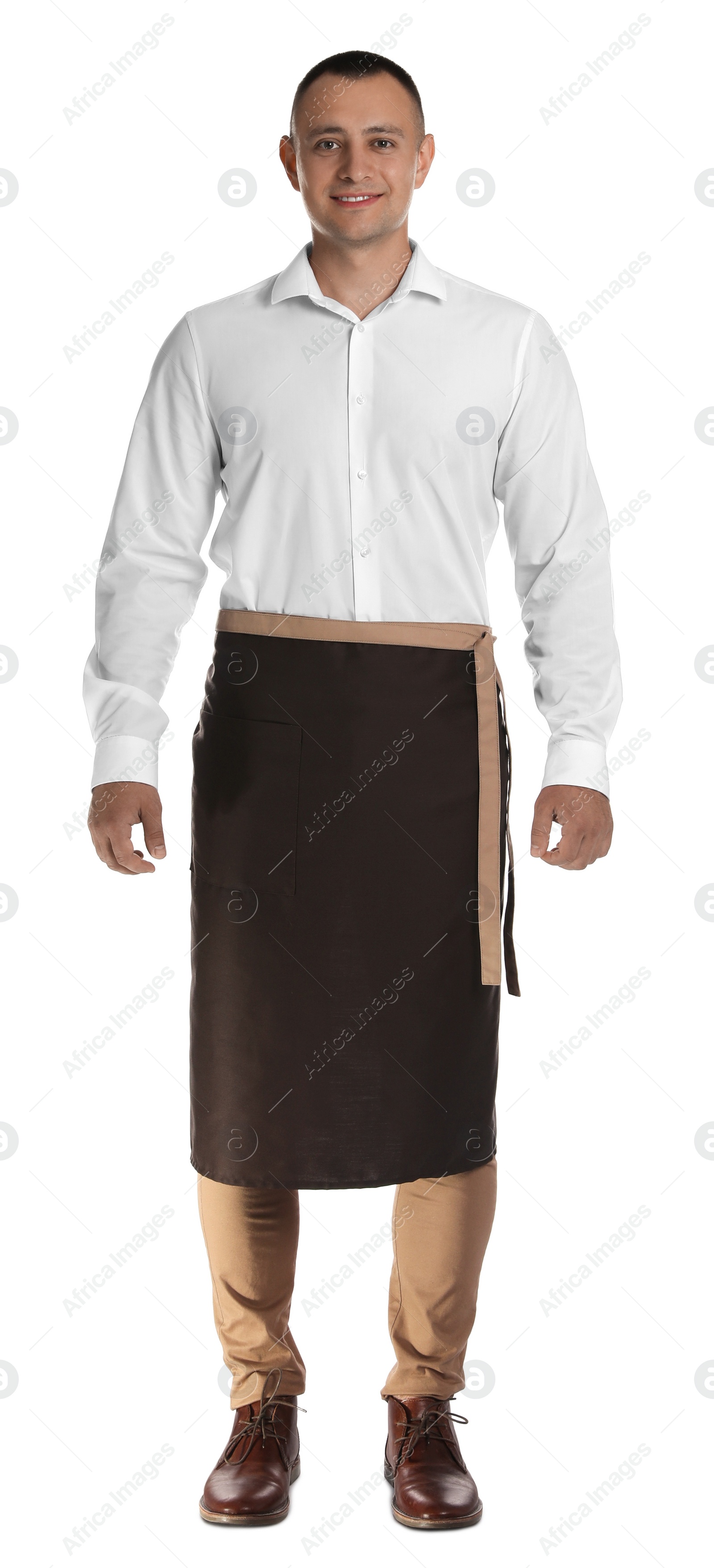 Photo of Full length portrait of happy young waiter in uniform on white background