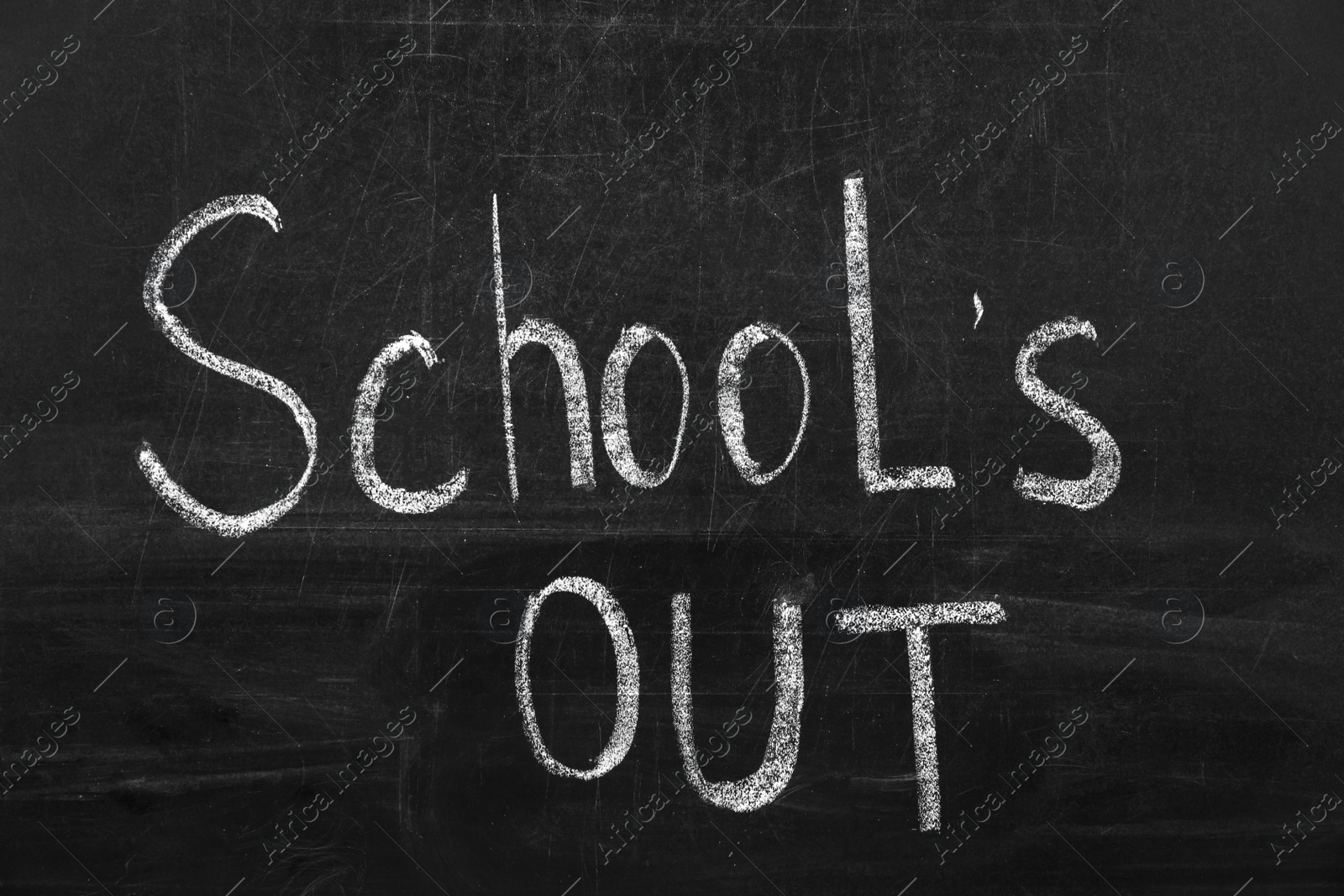 Photo of Text School's Out written on black chalkboard. Summer holidays