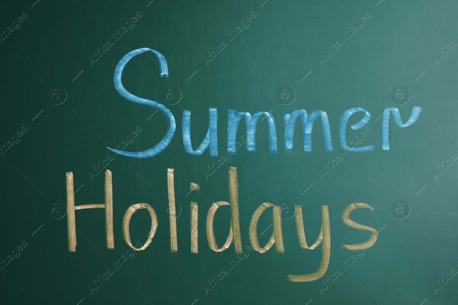 Photo of Text Summer Holidays written on school chalkboard